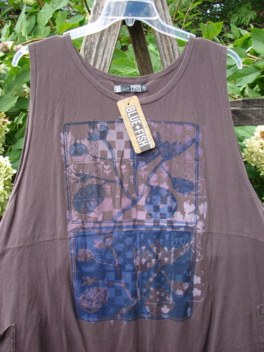 Barclay NWT Flower Pot Top Botanicals Brown Sparrow OSFA, featuring a checkerboard floral print, unique drop pockets, and a flared A-line shape, displayed outdoors with Blue Fish tag visible.