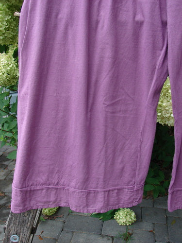 Barclay Basic Pocket Flutter Flare Pant Unpainted Magenta Size 2, featuring wide legs and a flutter accent, hangs outdoors, showcasing its elastic waist and generous pockets against a natural backdrop.