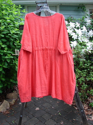 Barclay Linen Pleated Pocket Swing Dress Unpainted Geranium Size 2 features wide pleats, a curved empire waist, and low inseam pockets, embodying BlueFishFinder's creative and vintage aesthetic.