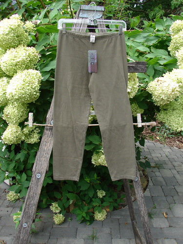 Barclay NWT Cotton Lycra Crop Legging Unpainted Brown Earth Size 0 hanging from a clear hanger, showcasing a full elastic waistband and tapering lowers, perfect for mixing and matching.