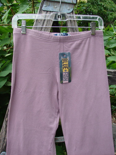 Barclay NWT Cotton Lycra Crop Legging Unpainted Tulsi Rose Size 0 hanging on a clear hanger, featuring a thin elastic waistband and tapered design, ideal for versatile styling.