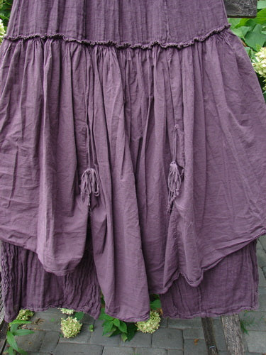 Barclay NWT Linen Batiste Fusion Pant Skirt Unpainted Fig Size 0, showcasing a tiered design with ruffles and decorative tassels, highlighted by a full elastic waistline and layered skirt-like accents.