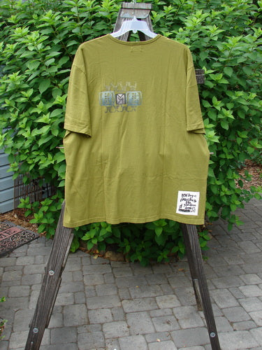 2000 NWT Short Sleeved Tee with Celebrate Logo on a Clothes Rack