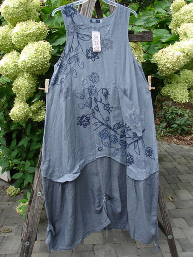 Barclay NWT Linen Explorer Jumper Trailing Botanicals Blue River Mist Size 0 features a layered slate-gray design with floral-vine print, scoop neckline, and drawcord back, displayed on a hanger against a natural backdrop.