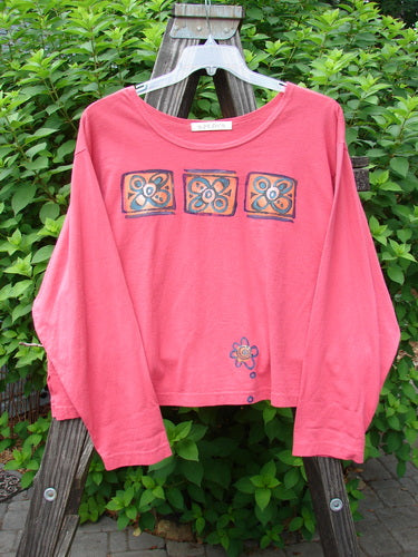 1997 Long Sleeved Crop Tee Tri Window Box Geranium Size 2: A pink shirt with a drawing of a tri window box theme paint.