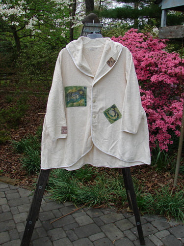 1996 Patched French Terry Cape Cod Coat in White Pine OSFA with farm-themed patches, oversized front pockets, single button closure, and rounded A-line shape, displayed outdoors.