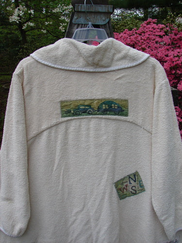 1996 Patched French Terry Cape Cod Coat Travel White Pine OSFA, featuring a large V-neck collar, single button closure, oversized front pockets, and various farm-themed patches on a white jacket.