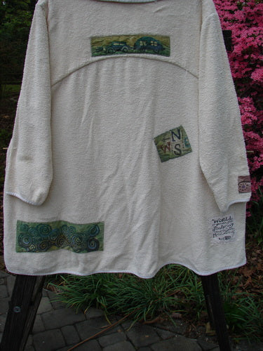 1996 Patched French Terry Cape Cod Coat Travel White Pine OSFA, featuring an A-line shape, oversized front pockets, single button closure, V-neck collar, and farm theme patches. Cozy, lightweight, and textured.