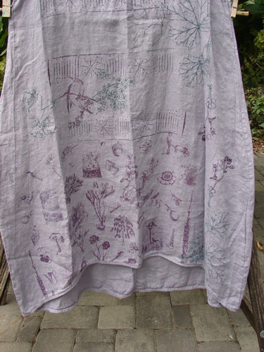 Barclay NWT Linen Sundress Garden Folly Amethyst Size 0, featuring a lightweight botanical print fabric with mushrooms and flowers, draped outdoors showing the full width, emphasizing creative individuality in vintage style.