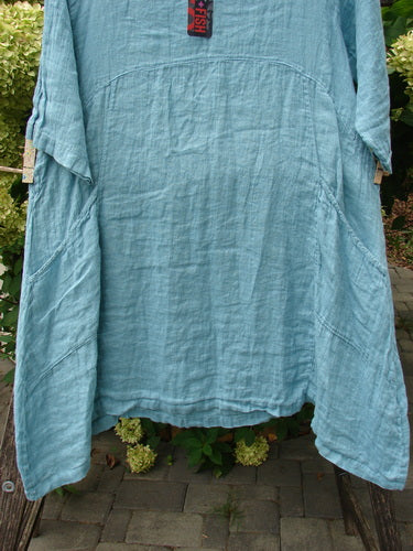 Barclay NWT Linen Zen Pocket Tunic Dress Unpainted Turquoise Size 0 features a loose-fit, knee-length design with three-quarter sleeves, large hip pockets, and a rounded yoke, highlighting BlueFishFinder's vintage style.