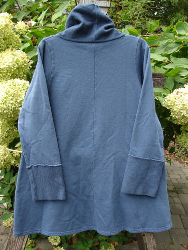 Barclay NWT Fleece Cowl Neck Sweatshirt Metallic Daisy Vintage Indigo Size 0, featuring a tunic-style hoodie, A-line shape, Celtic moss details, and metallic wheat art, displayed against greenery and hydrangeas.