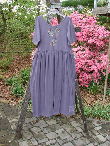 1996 Short Sleeved Simple Dress Tree of Life Purple Martin Size 0, featuring a deeper rounded neckline, drop empire waist, full sweeping skirt, and Blue Fish’s signature Tree of Life theme paint.