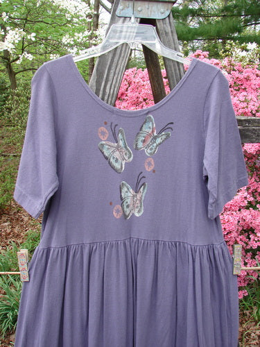 1996 Short Sleeved Simple Dress Tree of Life Purple Martin Size 0, featuring butterfly patterns, deeper rounded neckline, drop empire waist seam, and full sweeping skirt. Perfect condition, organic cotton.