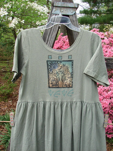 1996 Short Sleeved Simple Dress Sunflower Cricket Size 0, featuring a deeper rounded neckline, drop empire waist seam, and sweeping skirt with Blue Fish Stamp and Sunflower Garden Theme Paint, displayed on a hanger.