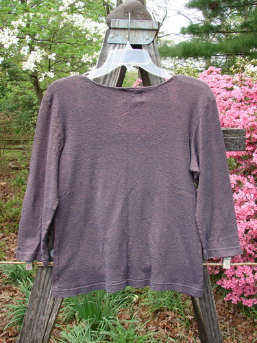 2000 Litmus Squareneck Top Unpainted Iron Size 1 displayed on a swinger, showcasing its wider rounded neckline, neatly stitched accents, and slightly flared hip.