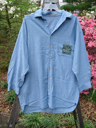 1998 Men's Lightweight Brushed Cotton Long Sleeved Oxford Shirt Earth Indigo Size XL displayed on a swinger, highlighting its painted breast pocket, elongated tapered shape, and unique buttoned cuffs.