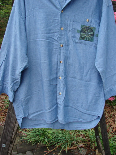 1998 Men's Lightweight Brushed Cotton Long Sleeved Oxford Shirt Earth Indigo Size XL, featuring a painted breast pocket, tiny button closures, and a scooped front hemline with longer rear hemline.