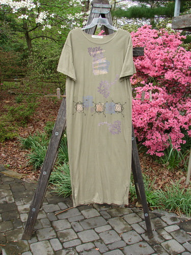 1996 Long Tee Dress Pathway Cricket Size 0 displayed on a clothes rack, showcasing its longer straighter shape, rounded paneled neckline, and short wide sleeves, with the signature Blue Fish patch.