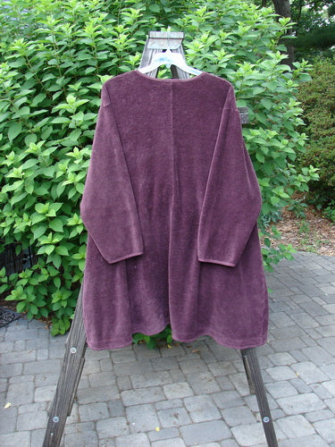 Image alt text: Barclay Chenille Rippie Tie Front Robe Jacket in Murple, size 2, on a swinger. Double drop front pockets, A-line shape, varying hemline, vertical cotton paneling, deep V neckline, double stitched sleeves, loop and rippie closures. Bust 62, waist 66, hips 70, sweep 80, front length 35, back length 40 inches.