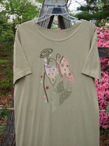 1996 Long Tee Dress Butterfly Cricket Size 0, featuring a butterfly design on the front, rounded paneled neckline, short wide sleeves, and a pegged vented hemline, made from organic cotton.