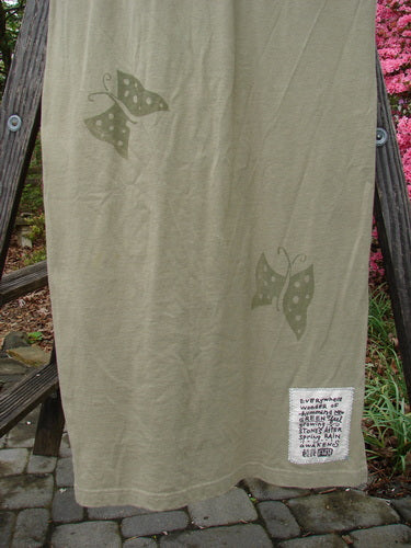 1996 Long Tee Dress Butterfly Cricket Size 0 - Organic cotton dress featuring a rounded paneled neckline, short wide sleeves, seamless design, and butterfly-themed paint, hanging outdoors on a clothesline.