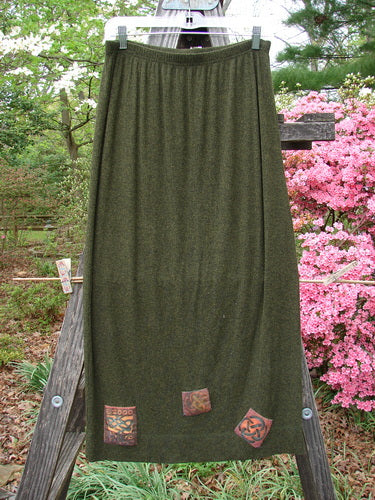 2000 Patched Rayon Lycra Rib Linear Skirt Green Oak Heather Size 0 displayed on a wooden stand, showcasing its full elastic waistband, slightly flared shape, and detailed exterior horizontal lower hem stitchery.