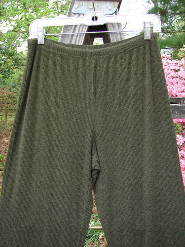 2000 Rayon Lycra Rib Flare Pant Unpainted Green Oak Heather Size 1 hanging on a clothesline, showcasing its full elastic waistline and slightly flared bottom with a superior drape.