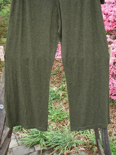 2000 Rayon Lycra Rib Flare Pant Unpainted Green Oak Heather Size 1 displayed draped over a wooden fence, highlighting its full elastic waistline, slightly flared bottoms, and superior drape.