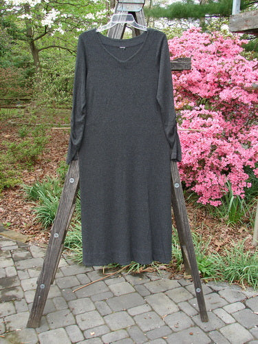 2000 Rayon Lycra Rib Julia Dress in Charcoal Heather, displayed flowing long on a wooden ladder, showcasing its sectional front crisscross and gathered forearms, embodying Bluefishfinder.com's vintage elegance.