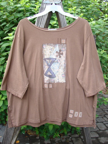 A brown shirt with a graphic design featuring a chemistry study theme. Barclay Short Sleeved Studio Tee Chem Study Mocha Size 3.