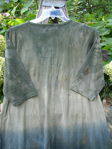 Barclay NWT Wander Tunic Tee Sunflower Mottled Vintage Camo Size 0 features a dip-dyed design in moss green to muted blue, with a straighter tunic length and slight A-line flair, hanging outdoors.