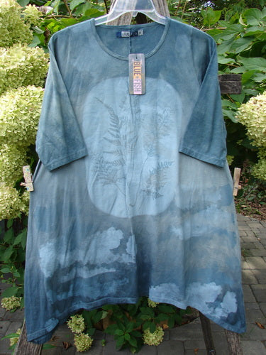 Barclay NWT Wander Tunic Tee Moon Fern Mottled Grey Green Size 0 displayed outdoors, showcasing its loose fit and moon fern design on organic cotton, featuring a round neckline and gentle A-line flair.