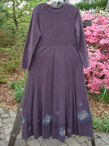 1998 Rib Top Dress Circle Floral Morado Size 1 displayed on a clothes rack, featuring stitched scooped neckline, ribbed upper bodice, empire waist, and flowing lower with floral theme paint.