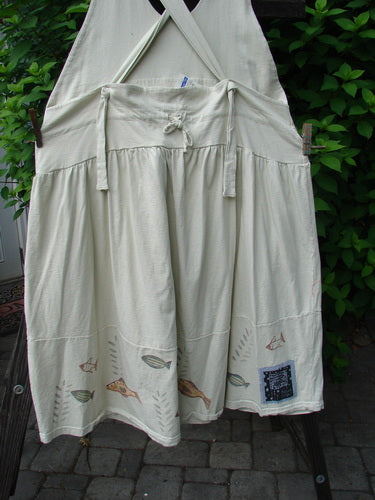 Image alt text: "1999 NWT Tadpole Jumper with fully adjustable shoulder straps, huge sweeping hemline, and criss-cross lower back, featuring a single stripe pike design and Blue Fish patch"