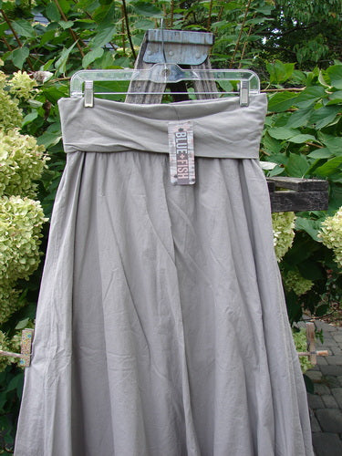 Barclay NWT Batiste Fold Over Stardust Tier Skirt in Moon Rock Sand, Size 0, displayed on a hanger showcasing its light-gray, double-layered cotton fabric with a fold-over waistband detail.