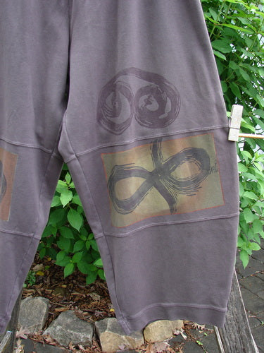 2000 Interlock Moors Pant Celtic Peat Size 2: Features rounded, pegged silhouette with elastic waistband, mid-leg bell, and three horizontal panels; crafted from dense cotton with Celtic-themed paint.