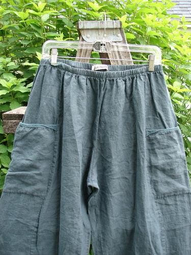 Barclay Linen Flutter Top Cargo Pant Unpainted Tealsa Size 1, featuring a thicker elastic waist, billowing fall, curved panels, inseam side pockets, and a slight crop length, embodying BlueFishFinder's unique vintage style.