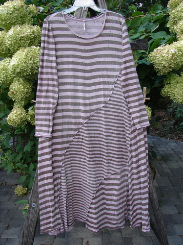 Magnolia Pearl Cotton Dylan Dress Hand Mended Lavender Stripe OSFA, a loose-fitting, horizontally striped dress with long sleeves, features a rounded neckline, A-line flair, and unique hand-mending details.