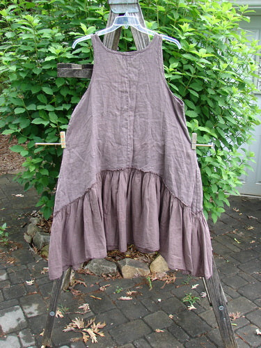 Barclay Linen Batiste Summer Frock Jumper Floral Grid Rosewood Size 0 features a subtle under stripe bodice, batiste flounce, downward yoke skirt, deep pockets, oval neckline, and ample arm openings.