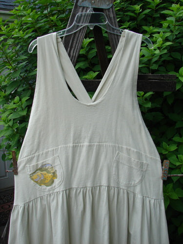 Image alt text: "1999 NWT Tadpole Jumper with a gold fish theme, made from organic cotton, featuring adjustable shoulder straps, a criss-cross lower back, and round bottomed pockets."