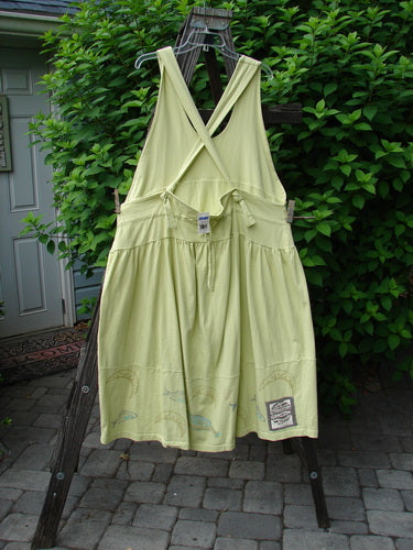 1999 NWT Tadpole Jumper: A dress on a clothesline with adjustable straps, a sweeping hemline, and round-bottomed pockets.