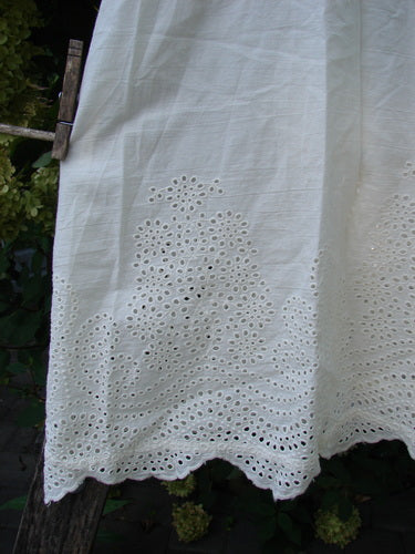 The Magnolia Pearl NWT Embroidered Eyelet Cotton Clementine Tank True OSFA features delicate broderie anglaise embroidery, scalloped edge, pintucked panels, and laced straps, showcasing Bluefishfinder.com's vintage-inspired aesthetic.