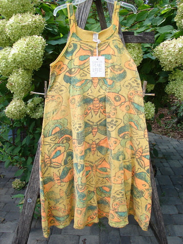 Magnolia Pearl NWT Cotton Fleece Lepidoptera Lana Tank Dress Butterfly Sunnies OSFA, featuring stylized moth and butterfly motifs, hanging outdoors with Fair Trade tag visible, highlighting its unique A-line design.