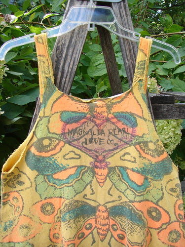 Magnolia Pearl NWT Cotton Fleece Lepidoptera Lana Tank Dress Butterfly Sunnies OSFA, featuring stylized butterfly motifs and raw edges, hangs outdoors on a ladder, embodying Bluefishfinder.com's vintage, expressive aesthetic.