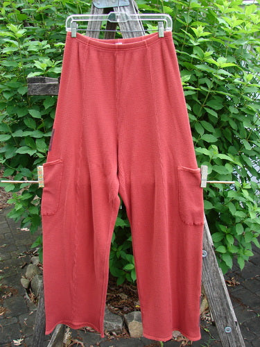 Barclay Thermal Patched Pottery Pant Leaf Sienna Size 1, featuring vertical stitchery, painted leaf patches, and deeper drop exterior pockets, with a full elastic waist and slightly tapered lowers.