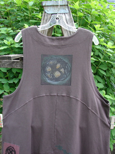 2000 Interlock Edinburg Vest Celtic Peat Size 1, featuring a dramatic pointed side hem, deeply cut arm holes, and colorful Celtic designs, embodying BlueFishFinder's unique vintage style and creative expression.