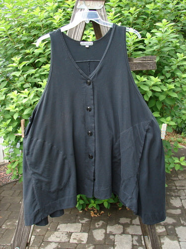 Barclay Column Vest Unpainted Midnight Size 2: Swingy shape vest with contrasting buttons, deep pockets, and a varying hemline. Made from organic cotton.