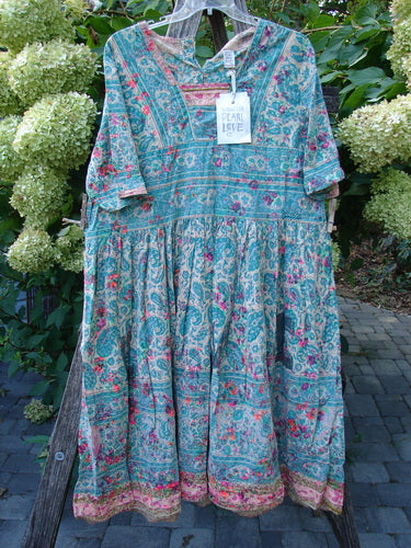 Magnolia Pearl NWT European Cotton Block Print Taigi Dress Demi OSFA features a bohemian style with a V-neck, button placket, elbow-length sleeves, tiered skirt, and floral paisley print.