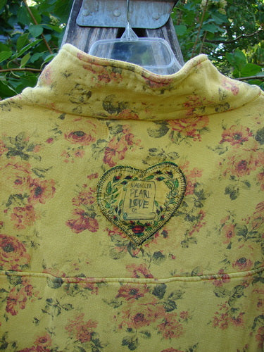 Magnolia Pearl NWT Cotton Fleece Asher Pullover Sweatshirt Vintage Rose Sunnies OSFA features a heart patch, rose-print fleece, and unique stitching details on a cropped, fleece jacket with a distinctive design.