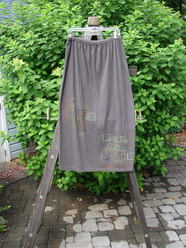 2000 Block Skirt on wooden ladder. Organic cotton. Patched and painted lower. Slightly flared shape. Blue Fish signature patch. Size 2.